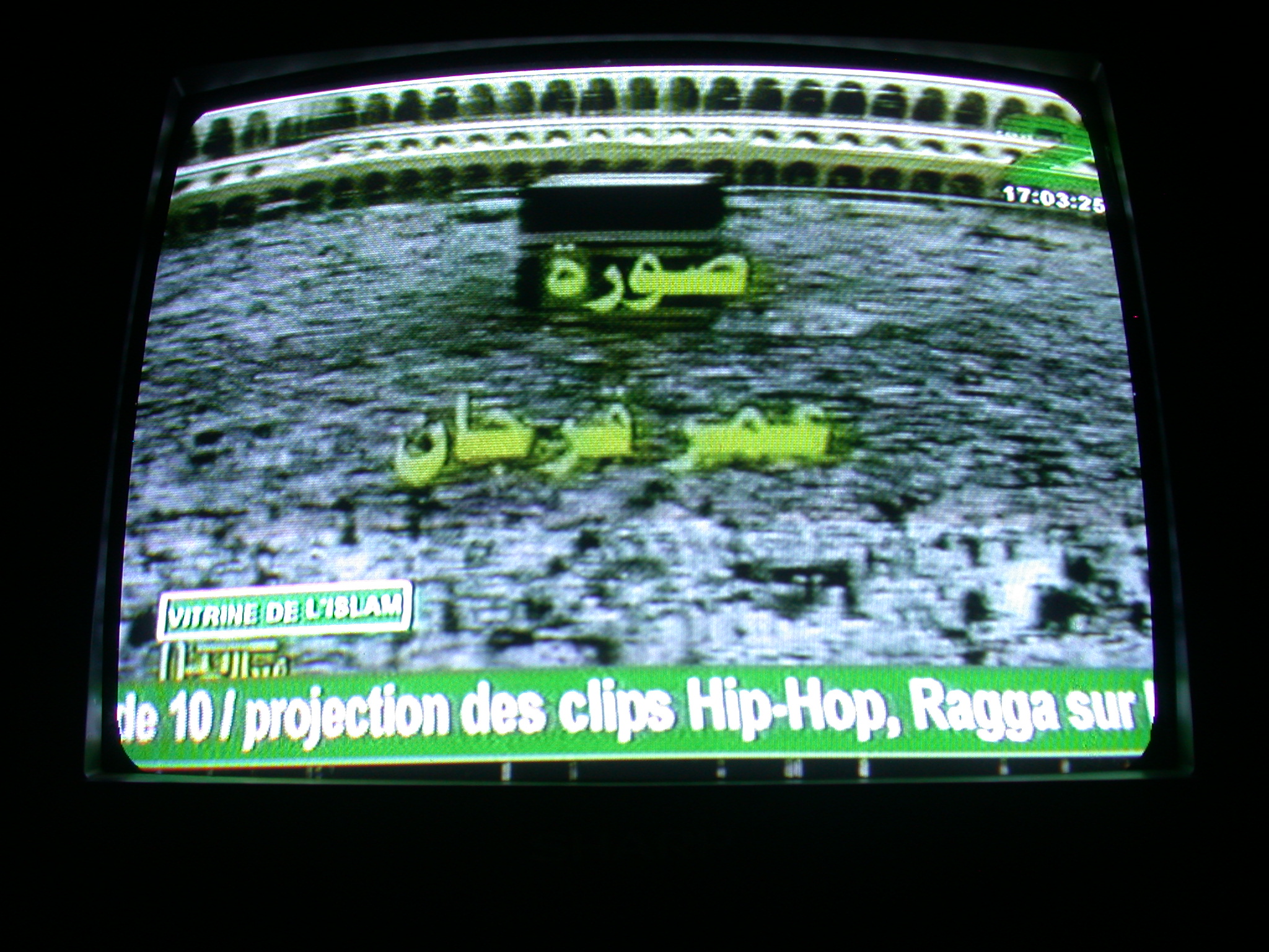 Hajj Pilgrims Circle Kaaba in Mecca on French-Advertised Television, Abomey, Benin