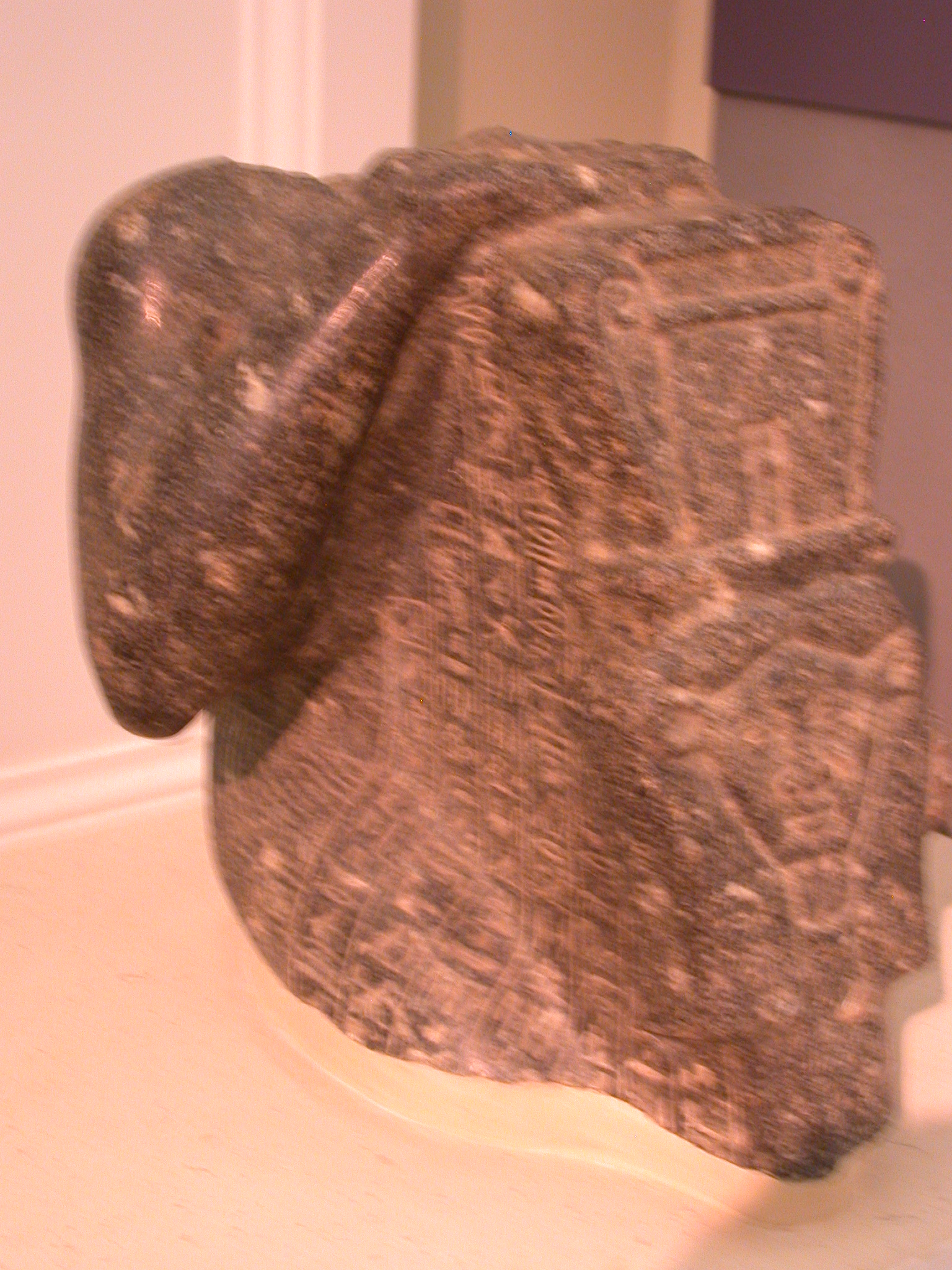 Statue of Priest Holding Large Sistrum in Form of Hathor, Granite, Late Period, 746-336 BCE, Mendes, Egypt, in Fitzwilliam Museum, Cambridge, England